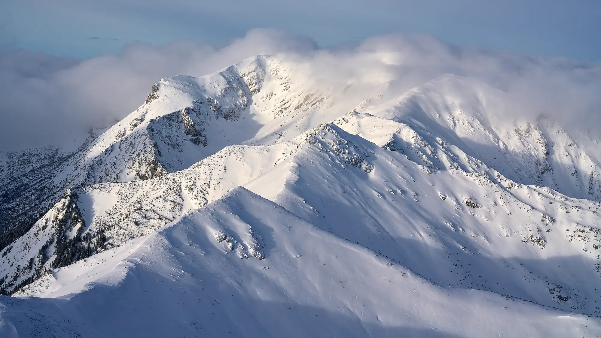 Snow-covered peaks of the Tatra Mountains under clear winter light